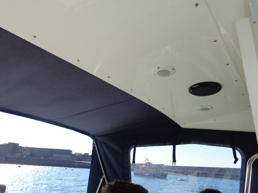 Ferry leaving Braye Harbour, Alderney, on the evening of Monday, 17th April, sailing to Guernsey. The harbour wall can be seen through the window.