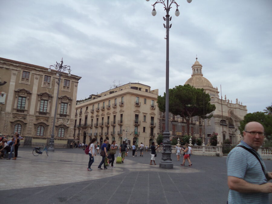 View across the north side of historic Piazza dell Duomo. The large domed building to the right is the Abbey of St Agatha (Badia di Sant'Agata). This 18th century church stands opposite Catania Cathedral, and like the cathedral, is Baroque in style. Also like the cathedral it is dedicated to Saint Agatha, patron saint of Catania. An earlier monastery on this site was destroyed by the 1693 earthquake.