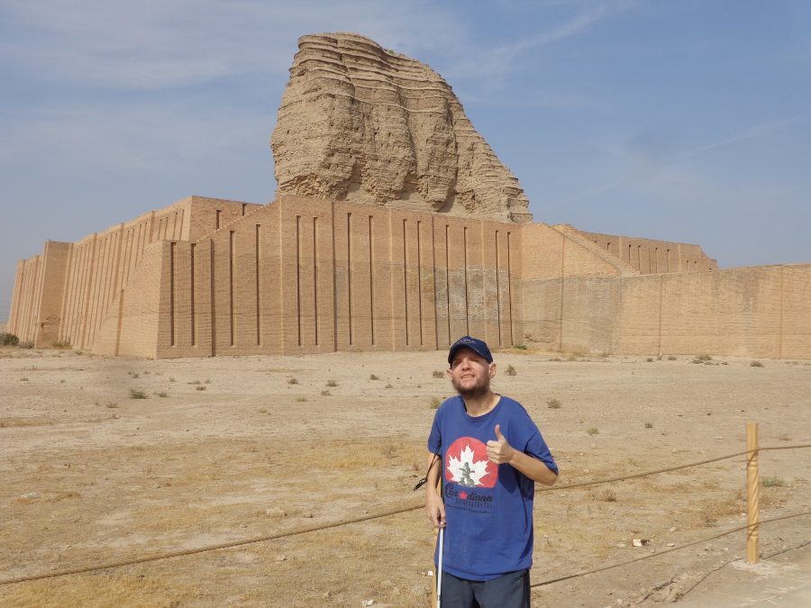 The Ziggurat of Dur-Kurigalzu in the background and Tony with thumbs up in the foreground. The original mud brick structure of the ziggurat incorporated reed mats between every seven layers of brick to help hold the structure together. These layers can still clearly be seen in the ziggurat's weathered structure.