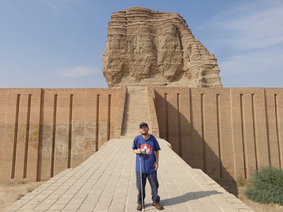 Another shot of Tony on the walkway leading up to the Ziggurat. The lower section of the Ziggurat has been restored, and the tall retaining walls of sun-dried brick contain rows of tall narrow vertical recesses, presumably  resembling how the Ziggurat would have originally looked.