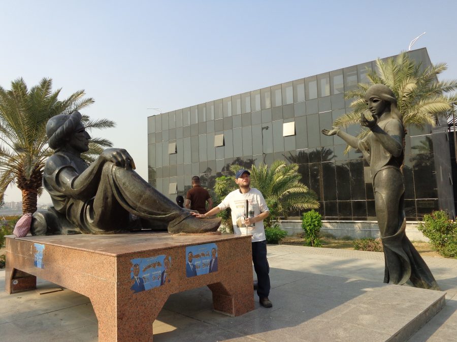Tony with the sculptures of Queen Scheherazade and King Shahryar created by Mohammed Ghani Hikmat in 1971. These are both characters from the One Thousand and One Nights folktales (also known as The Arabian Nights in English). These stories were first published in English in the early 18th century.