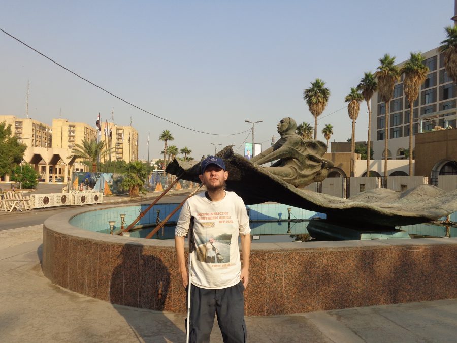 Tony stood in front of a large, almost empty fountain with a bronze statue in the centre depicting a robed male figure sitting on a magic flying carpet. This is taken from a story in One Thousand and One Nights. Prince Husain, the eldest son of the Sultan of the Indies, travels to Bisnagar in India and buys a magic carpet which will fly and transport the person sitting on it should they will it by thought. This sculpture was created by Mohammed Ghani Hikmat and was completed in 1989.